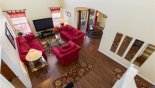 View from the 1st floor showing the large family room with dining nook and entrance foyer to the right with this Orlando Villa for rent direct from owner