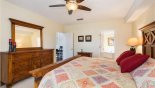 Spacious rental Emerald Island Resort Villa in Orlando complete with stunning Master bedroom #1 with chest of drawers and mirror above through to the large ensuite