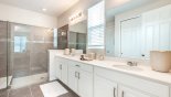 Master #1 ensuite bathroom with large walk-in shower, dual vanities & separate WC with this Orlando Villa for rent direct from owner