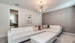Entertainment loft with comfortable white leather sectional sofa set - www.iwantavilla.com is the best in Orlando vacation Villa rentals