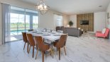 Dining area with views & direct access onto pool deck - family room in the background with this Orlando Villa for rent direct from owner