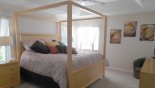 Master bedroom with four poster bed king sized bed from Canterbury 5 Villa for rent in Orlando