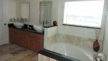 His and hers vessel sinks and large tub with this Orlando Villa for rent direct from owner