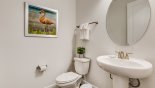 Cloakroom with WC & pedestal sink with this Orlando Villa for rent direct from owner