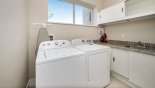 Orlando Townhouse for rent direct from owner, check out the Downstairs laundry room with washer, dryer, iron & ironing board