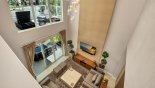 Delight 4 Townhouse rental near Disney with Upstairs landing viewed down onto living room below - note private balcony with 2 sun loungers