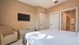 Master bedroom #1 with wall mounted LCD cable TV with this Orlando Townhouse for rent direct from owner