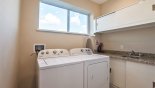 Laundry room with washer, dryer, iron & ironing board - www.iwantavilla.com is the best in Orlando vacation Townhouse rentals
