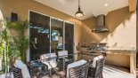Spacious rental Magic Village Resort Townhouse in Orlando complete with stunning Covered lanai with patio table & outdoor kitchen