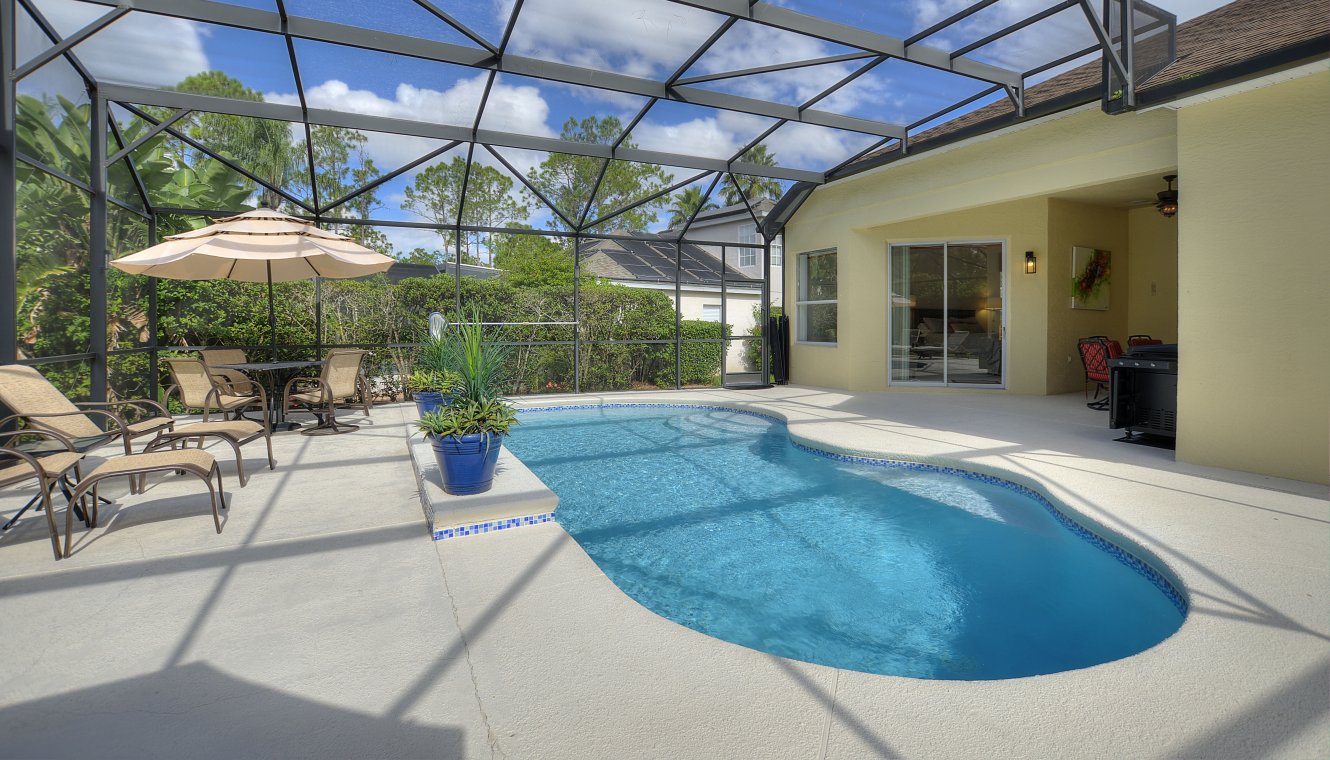 Pool deck with privacy hedges both sides