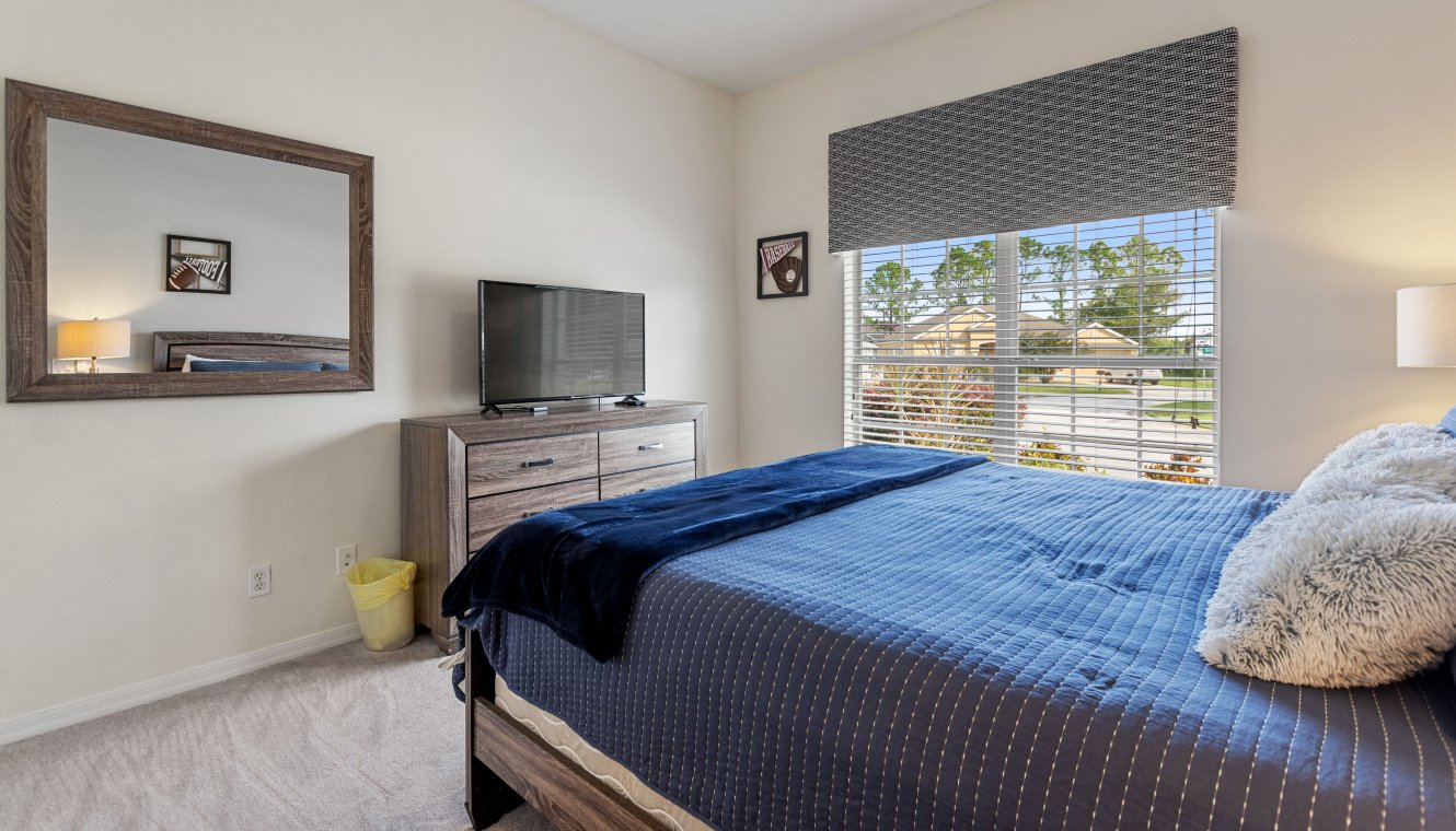 Ground floor bedroom #2 with king sized bed & views onto front gardens