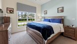 Ground floor bedroom #2 with king sized bed & views onto front gardens with this Orlando Villa for rent direct from owner