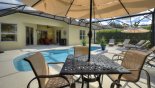 Poolside dining table with parasol from Highlands Reserve rental Villa direct from owner