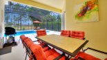 Covered lanai with patio table & 6 chairs - gas BBQ available for alfresco dining with this Orlando Villa for rent direct from owner
