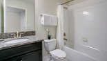 Spacious rental Champions Gate Villa in Orlando complete with stunning Family bathroom #4 with bath & shower over, single vanity sink & WC