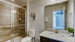 Master ensuite #2 with walk-in shower, single vanity & WC - www.iwantavilla.com is the best in Orlando vacation Villa rentals