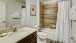 Villa rentals in Orlando, check out the Master ensuite bathroom #3 with bath and shower over, single sink & WC