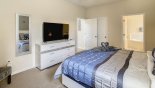 Villa rentals in Orlando, check out the Ground floor master bedroom #1 with large smart TV