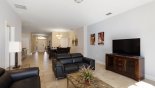 Family room with ample seating to watch a movie on the large LCD cable TV from Castillo 2 Villa for rent in Orlando