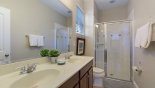 Master #1 ensuite bathroom with large walk-in shower, his & hers sinks & WC from Solterra Resort rental Villa direct from owner