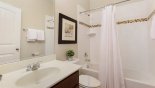Family bathroom #2 with bath & shower over, single vanity & WC from Solterra Resort rental Villa direct from owner