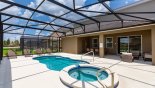 Spacious rental Solterra Resort Villa in Orlando complete with stunning Pool deck with 4 sun loungers - covered lanai with patio table & 8 chairs & soft seating area