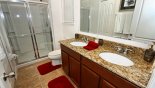 Master #1 ensuite bathroom with large walk-in shower, bath, his & hers sinks & WC from Antigua 1 Villa for rent in Orlando