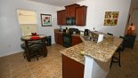 Villa rentals near Disney direct with owner, check out the Fully fitted kitchen and breakfast nook seating 4 plus 2 bar stools at breakfast bar