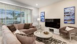 Family room with ample seating to watch a movie on the large LCD cable TV with this Orlando Townhouse for rent direct from owner
