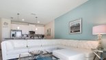 Townhouse rentals in Orlando, check out the Living room with L-shaped white leather sectional sofa - ample seating for all