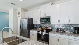 Fully fitted kitchen with quality appliances and granite counter tops - www.iwantavilla.com is the best in Orlando vacation Townhouse rentals