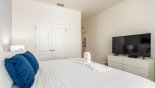 Master bedroom #4 with large LCD cable TV with this Orlando Villa for rent direct from owner