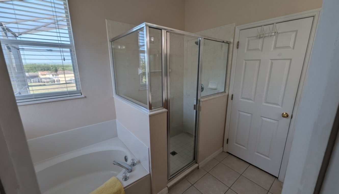Master #1 ensuite bathroom with Roman bath, his & hers sinks, large walk-in shower & separate WC