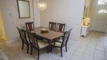 View of dining area and entrance hallway to right with this Orlando Villa for rent direct from owner
