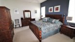 Villa rentals in Orlando, check out the Master bedroom #1 with king sized bed - LCD cable TV in cabinet