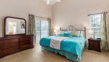 Master bedroom with king sized bed and views & private access onto pool deck from Highlands Reserve rental Villa direct from owner