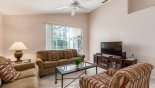 Family room with ample seating to watch a movie on the large LCD cable TV from Highlands Reserve rental Villa direct from owner