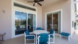 Orlando Villa for rent direct from owner, check out the Covered lanai with patio table & 4 chairs - footstool with chair enable an extra sun lounger