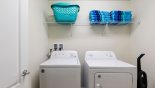 Laundry room with washer, dryer, iron & ironing board - www.iwantavilla.com is your first choice of Villa rentals in Orlando direct with owner