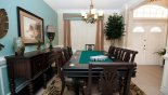 Spacious rental Highlands Reserve Villa in Orlando complete with stunning Dining area with dining table & 8 chairs - viewed towards entrance foyer