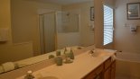 Master ensuite bathroom #1 with bath, walk-in shower, his & her sinks & WC - www.iwantavilla.com is the best in Orlando vacation Villa rentals
