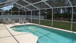 Sunny west facing pool deck with 4 sun loungers (2 are reclining chairs with footstools) from Highlands Reserve rental Villa direct from owner