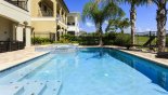View of pool and covered lanai on left with this Orlando Villa for rent direct from owner