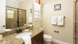 Ensuite bathroom #4 with walk-in shower, WC & single vanity from Crestview 8 Villa for rent in Orlando