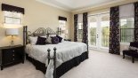 Crestview 8 Villa rental near Disney with Master bedroom #1 with king sized bed & private balcony overlooking pool & golf course