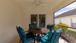 Spacious rental Highlands Reserve Villa in Orlando complete with stunning Covered lanai with patio table & 4 chairs - ceiling fan for additional comfort
