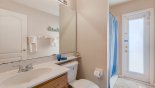 Master ensuite bathroom #2 with walk-in shower, single sink & WC - also serves the pool deck during the day from Highlands Reserve rental Villa direct from owner