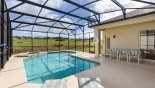Pool deck with 2 sun loungers and 4 chairs with this Orlando Villa for rent direct from owner