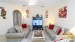 Family room with ample seating to watch a movie on the large LCD cable TV from Wasdale 1 Villa for rent in Orlando