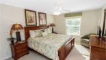 Villa rentals in Orlando, check out the Upstairs bedroom #4 with king sized bed, LCD cable TV & views over pool deck